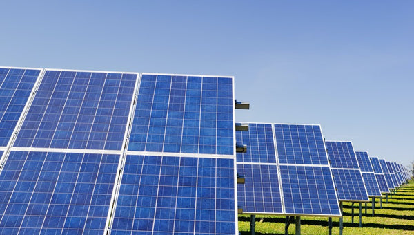 Solar panels producing renewable energy in a field