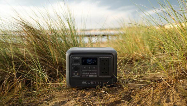 BLUETTI portable power station surrounded by coastal grass