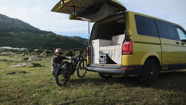 Portable Generator Next to a Camper Van Outdoors